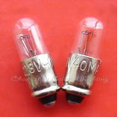 Miniature lamp 28v 40mA MG6 base 5x15mm filament bulb pair on red background